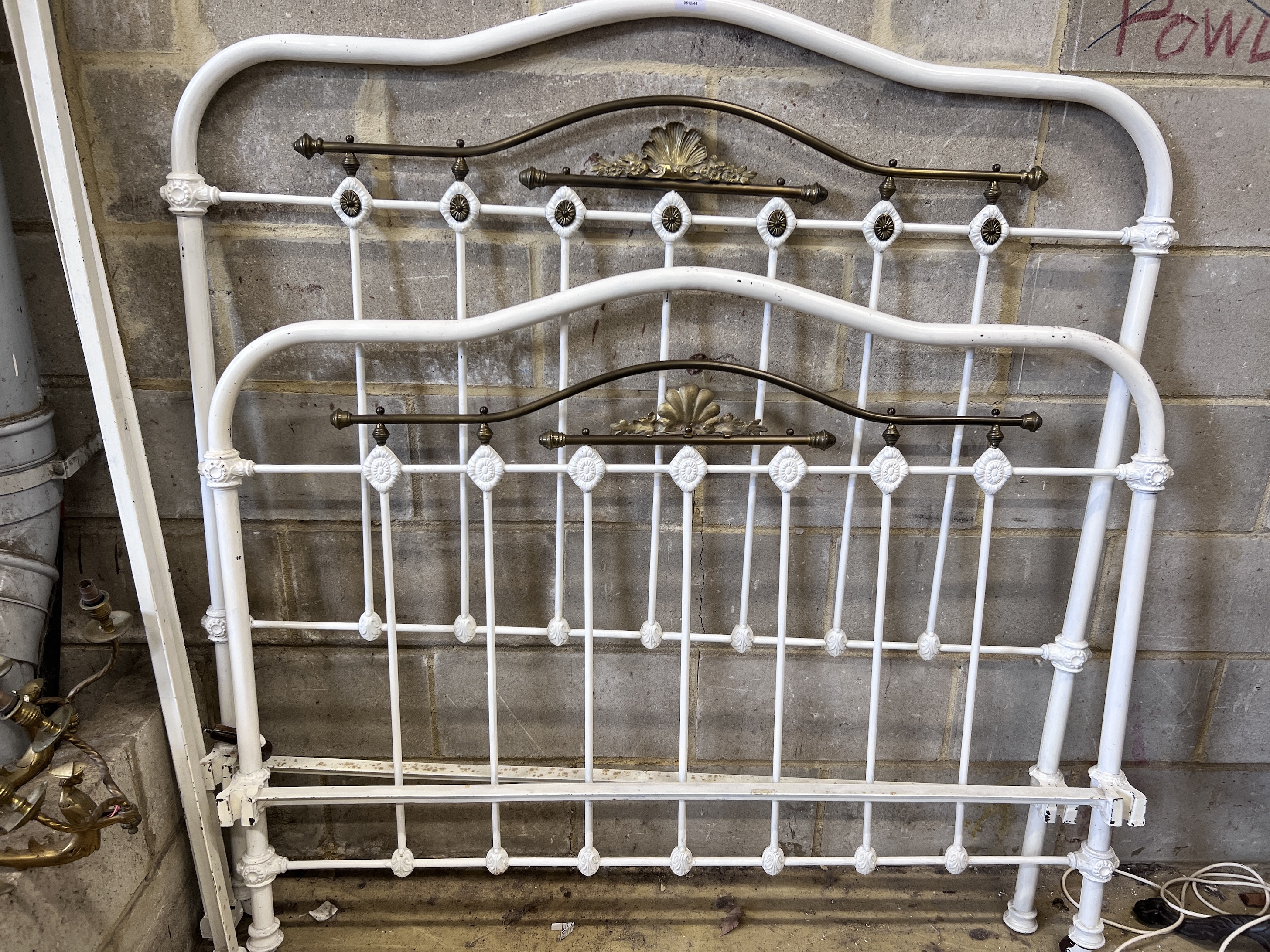 An Edwardian iron and brass bedstead, width 141cm